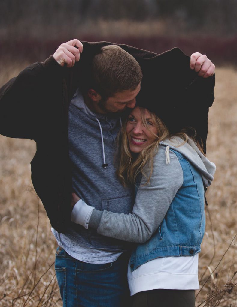 guy and girl in happy warm embrace