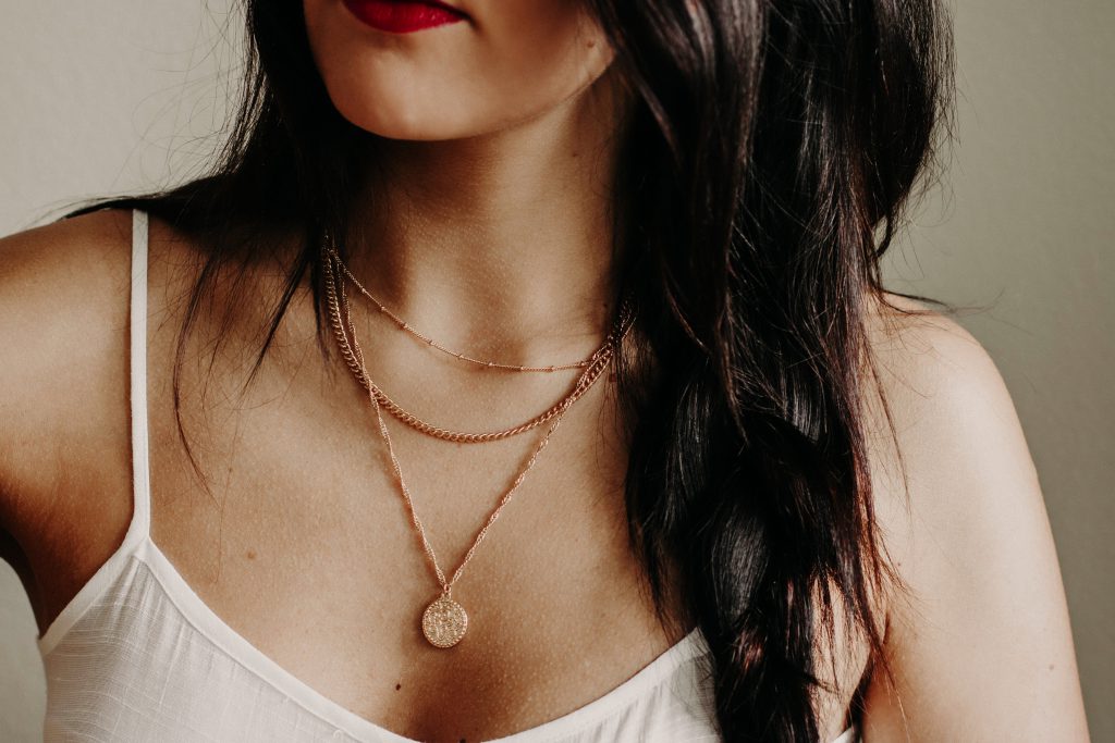 Woman wearing layered necklaces